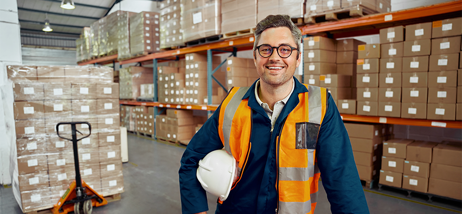 Happy warehouse manager in energy efficient warehouse